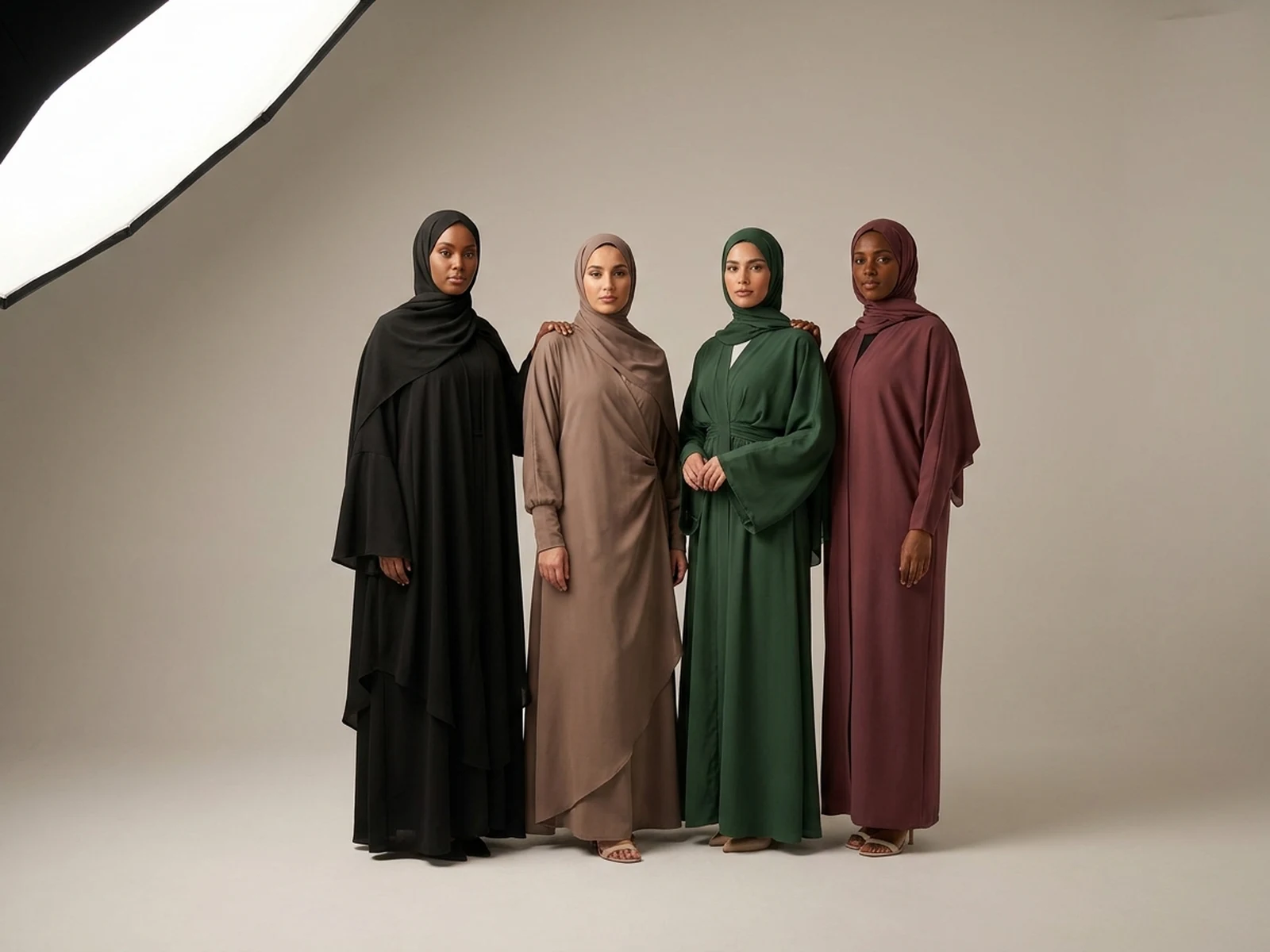 Four original abaya designs presented as a modest fashion capsule collection
