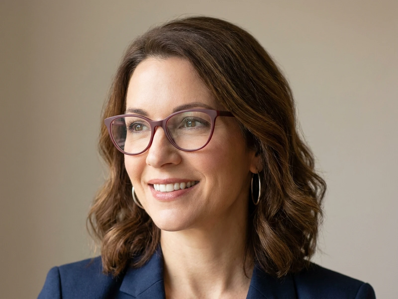Authorized three-quarter portrait with subtle cat-eye frames
