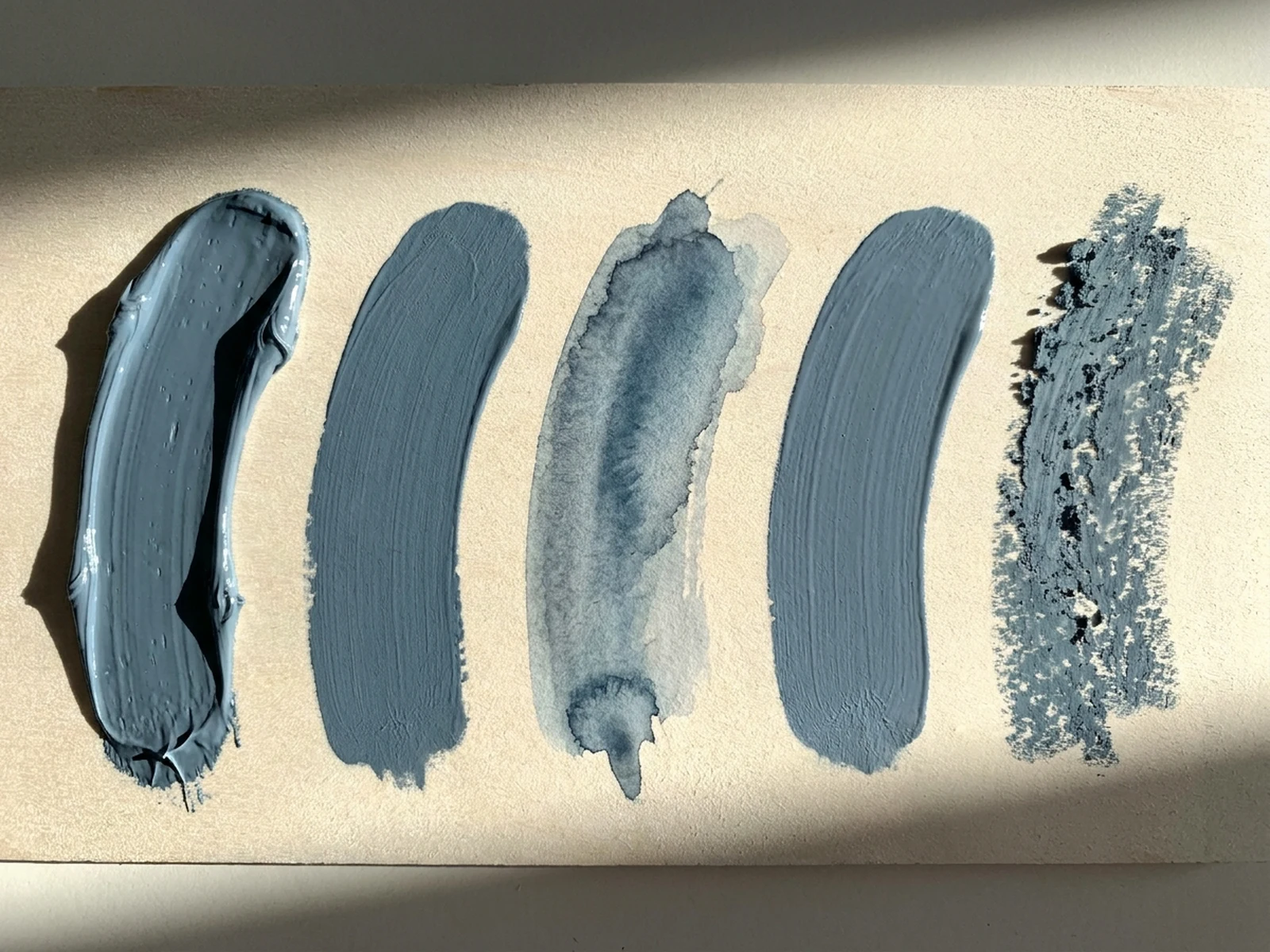 One curved brush gesture compared across five painting media