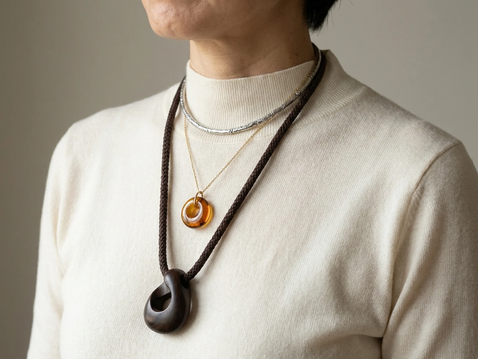 Authorized adult styling preview with three original necklaces