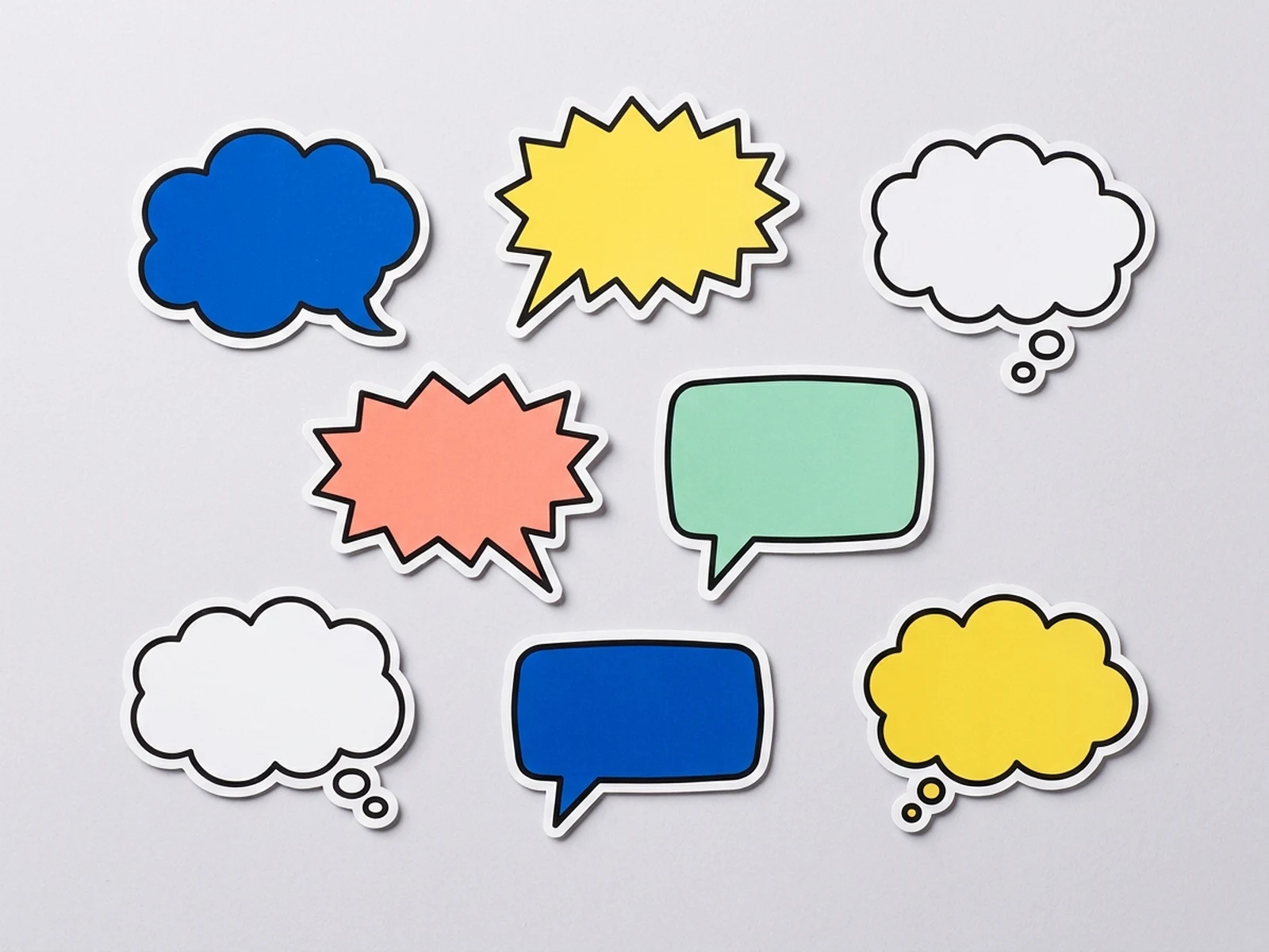 Eight colorful blank speech bubble stickers with bold outlines