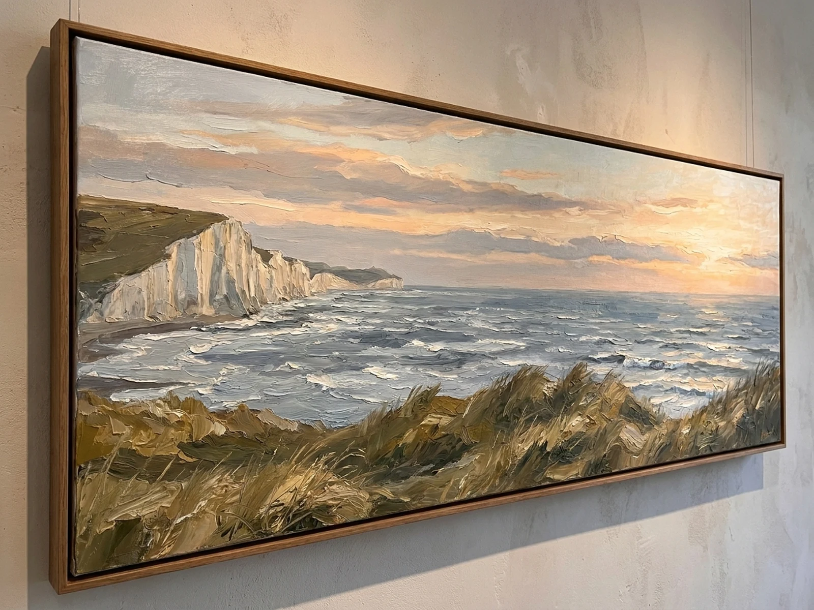 Coastal cliffs and blue-gray sea interpreted as a textured oil landscape